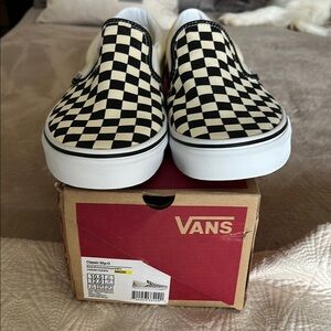 Vans Black and Cream Slip-On Sneakers